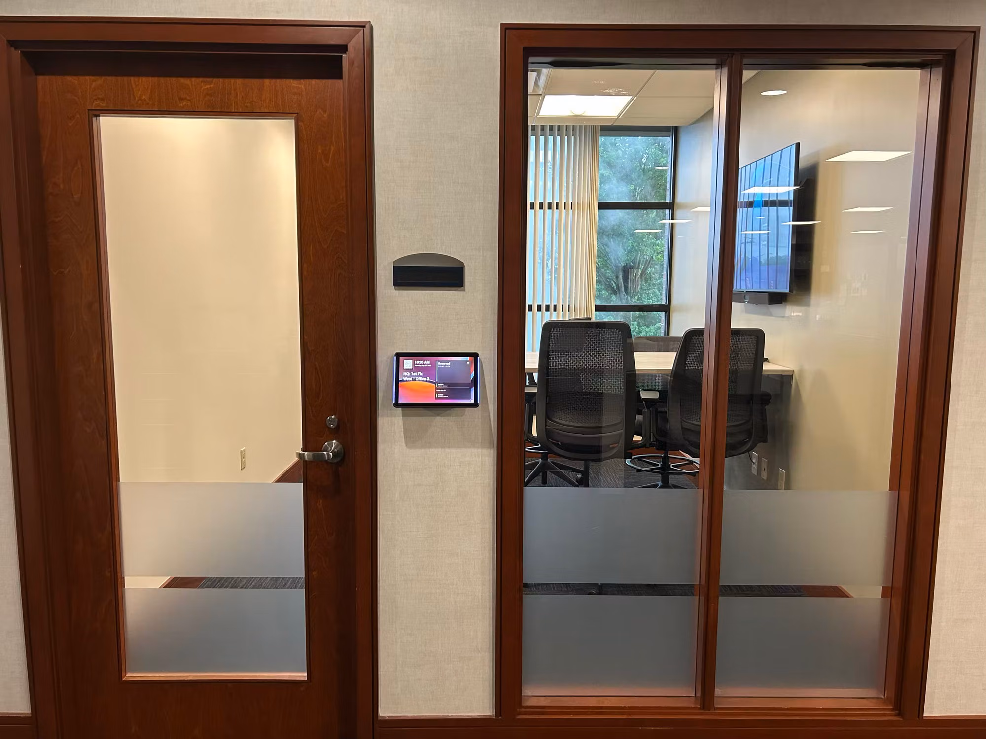 Office door and meeting room glass entry finished with frosted privacy bands on the lower glass panels.